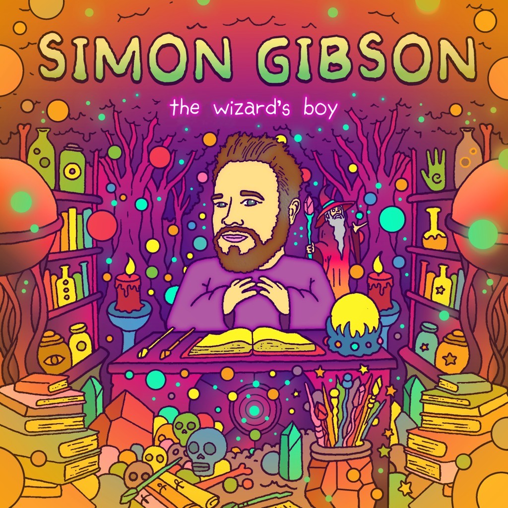 Album cover for Simon Gibson, The Wizard's Boy. A bearded man sits at a desk with an open book, surrounded by potions, skulls, candles, and a wizard.